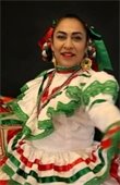 Woman dancing wearing colorful dress.